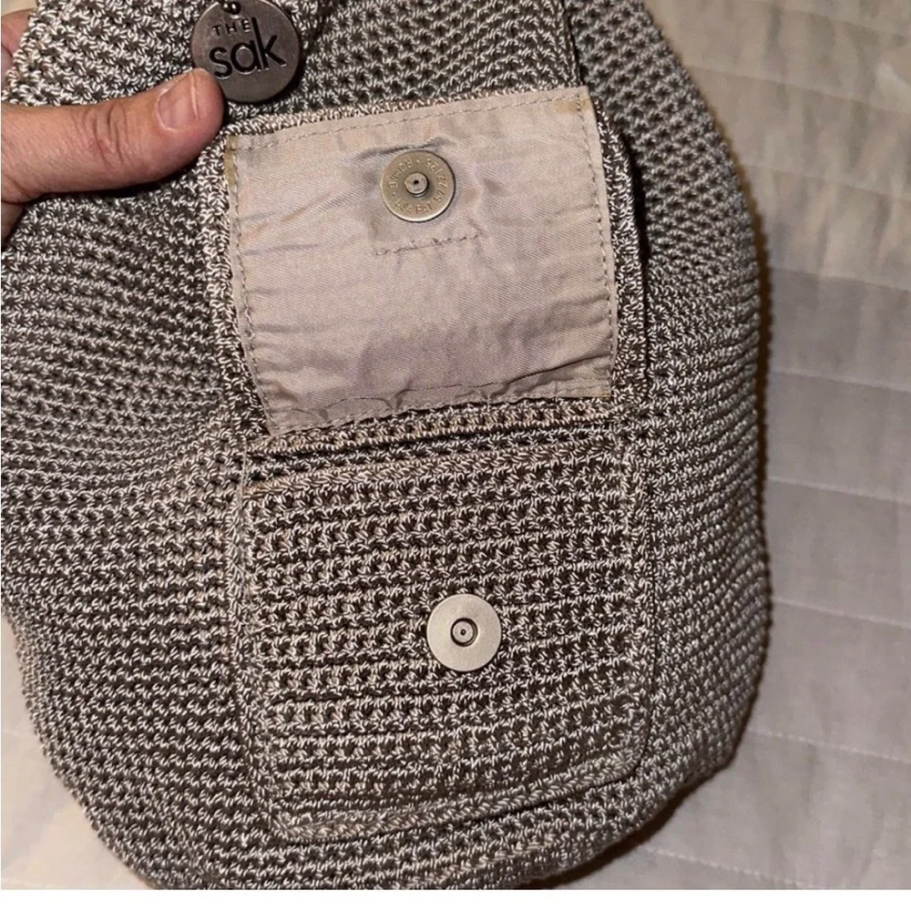 The Sak sling Backpack in the color mushroom